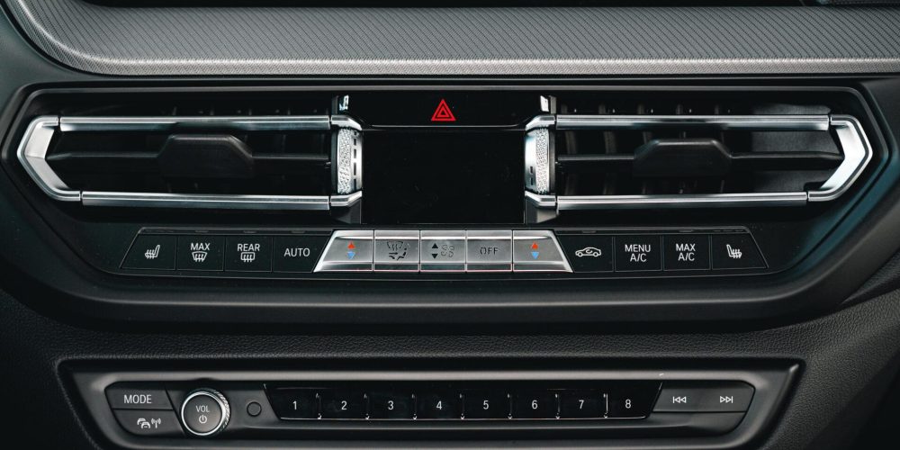 Buttons panel of the car on the dashboard close up